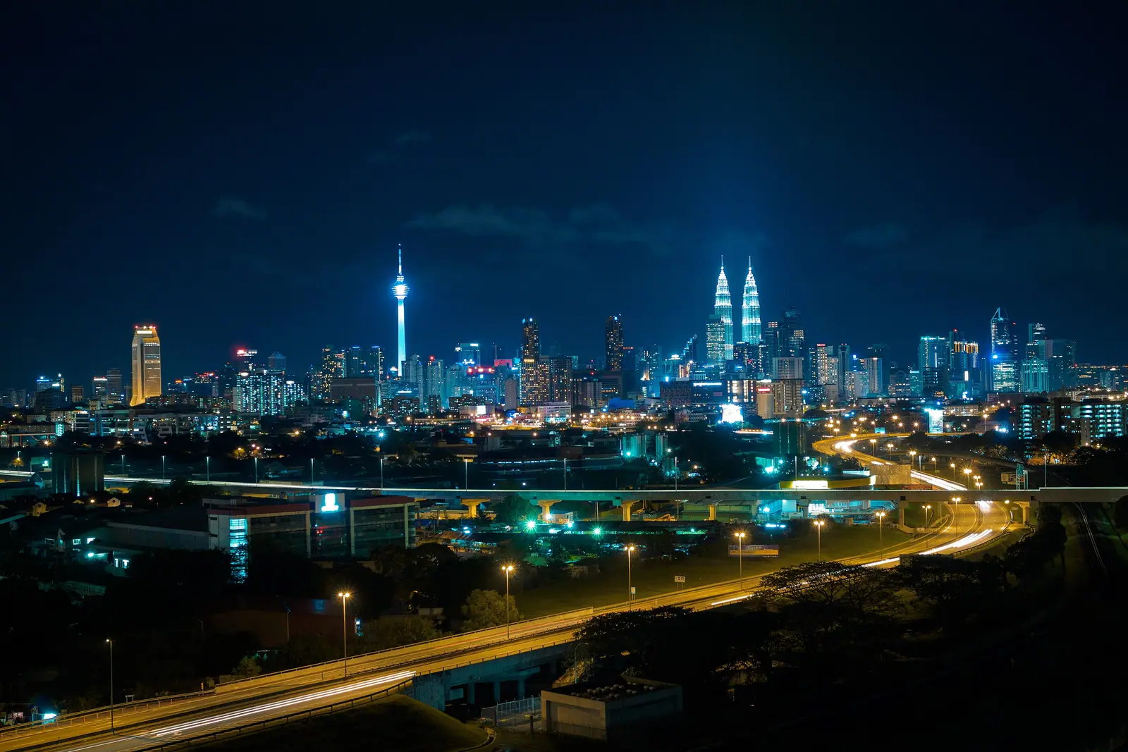 Kuala Lumpur skyline at night with the Petronas Twin Towers, where many karaoke Kuala Lumpur nights begin