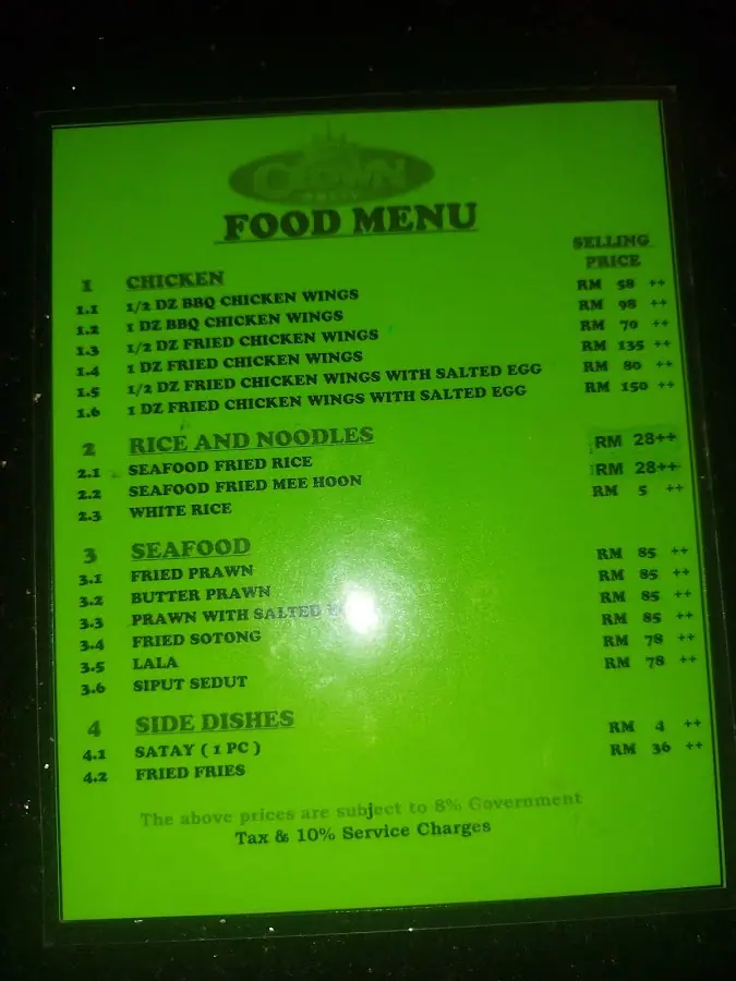 Crown KTV: Laminated Crown food menu (chicken wings, fried rice, seafood, satay) with RM prices; undated, mentions 8% government tax