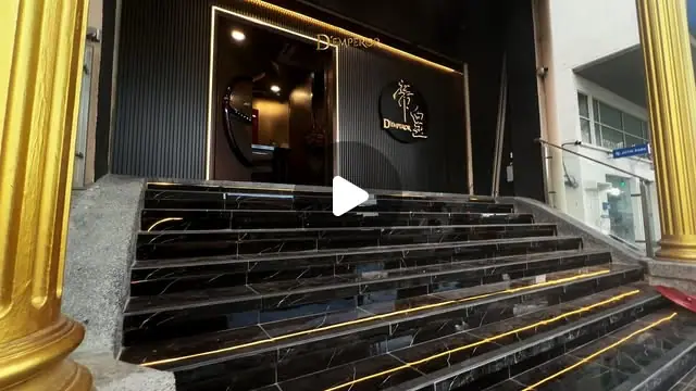 D'Emperor KTV (帝皇): Marble entrance staircase with gold pillars and the 帝皇 D'Emperor logo at the door (reel frame, play icon overlay)