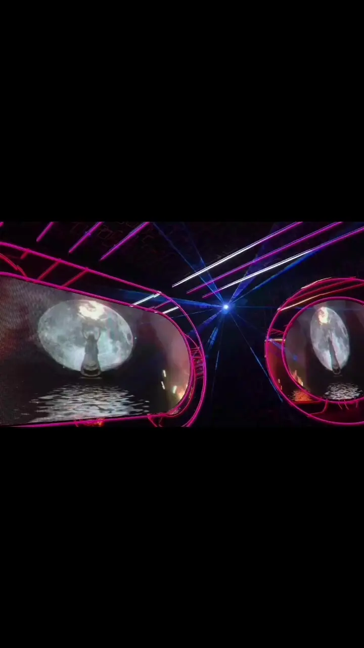 Golden Palace KTV (金色年华): Video still of a KTV room interior: neon pink-framed screens and laser lighting effects